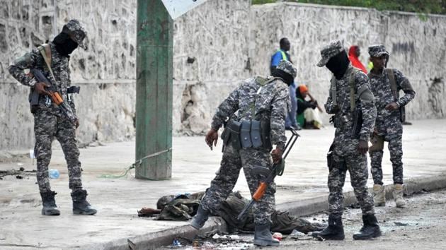 Somali soldiers look at the body of an alleged al-Shabaab fighter shot dead by security forces at the site of a car bombing in Mogadishu last month. The al-Qaeda affiliate regularly launch attacks in Mogadishu and elsewhere. (AFP/File Photo) Somali soldiers look at the body of an alleged al-Shabaab fighter shot dead by security forces at the site of a car bombing in Mogadishu last month. The al-Qaeda affiliate regularly launch attacks in Mogadishu and elsewhere. (AFP/File Photo)