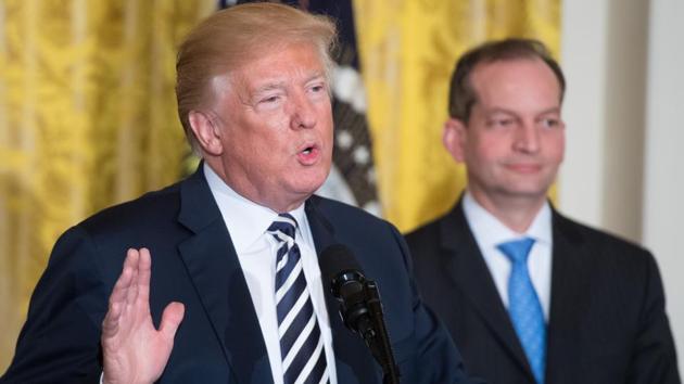 US President Donald Trump speaks alongside Secretary of Labor Alexander Acosta (R) during the National Teacher of the Year reception in the East Room of the White House in Washington, DC. (AFP) US President Donald Trump speaks alongside Secretary of Labor Alexander Acosta (R) during the National Teacher of the Year reception in the East Room of the White House in Washington, DC. (AFP)