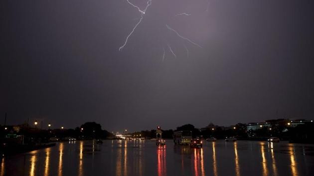 Lightning is seen during a thunderstorm over Rajpath in New Delhi on Wednesday. (PTI File Photo) Lightning is seen during a thunderstorm over Rajpath in New Delhi on Wednesday. (PTI File Photo)