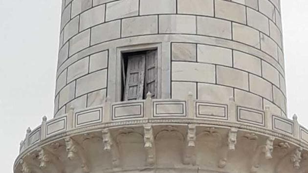 Wednesday’s thunderstorm displaced a wooden door in the Taj Mahal’s northwest minaret.(HT Photo)