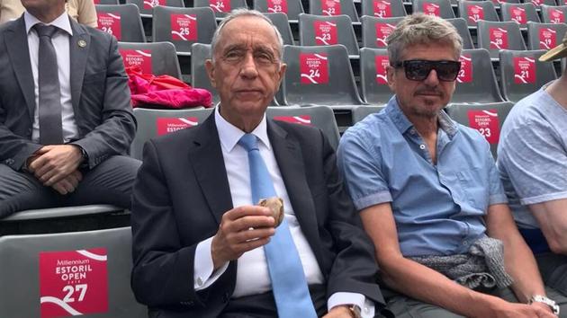 Marcelo Rebelo de Sousa, president of Portugal, having some refreshments while enjoying the action at the Estoril Open tennis tournament.(Twitter - Estoril Open)