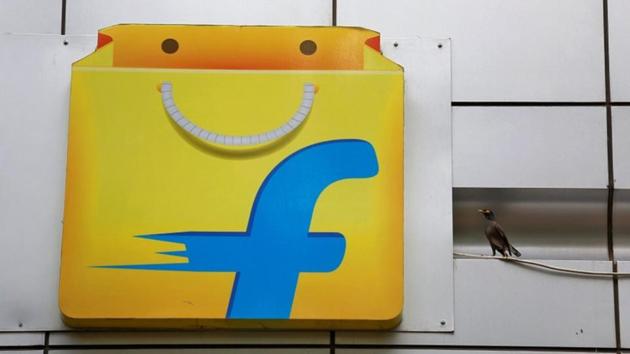 A Common myna sits next to the logo of India's e-commerce firm Flipkart installed on the company's office in Bengaluru, India April 12, 2018. REUTERS/Abhishek N. Chinnappa(REUTERS File Photo)