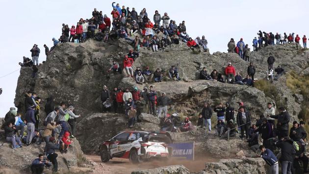 People watch driver Ott Tanak and his co-driver Martin Jarveoja, both from Estonia, race their Toyota Yaris WRC during the FIA World Rally Championship in El Condor, Cordoba, Argentina. (Nocolas Aguilera / AP) People watch driver Ott Tanak and his co-driver Martin Jarveoja, both from Estonia, race their Toyota Yaris WRC during the FIA World Rally Championship in El Condor, Cordoba, Argentina. (Nocolas Aguilera / AP)