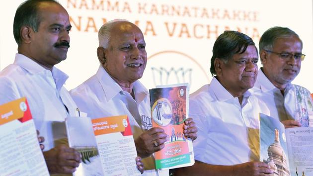 Karnataka BJP president and chief ministerial candidate B.S. Yediyurappa (2L) releases the party’s manifesto along with other senior party leaders from the state in Bangalore. The manifesto called “Namma Karnataka Namma Vachana” for the May 12 Karnataka elections promised a range of schemes for farmers, from waiving all loans of up to Rs 1 lakh to sending them abroad for training. (Manjunath Kiran / AFP) Karnataka BJP president and chief ministerial candidate B.S. Yediyurappa (2L) releases the party’s manifesto along with other senior party leaders from the state in Bangalore. The manifesto called “Namma Karnataka Namma Vachana” for the May 12 Karnataka elections promised a range of schemes for farmers, from waiving all loans of up to Rs 1 lakh to sending them abroad for training. (Manjunath Kiran / AFP)