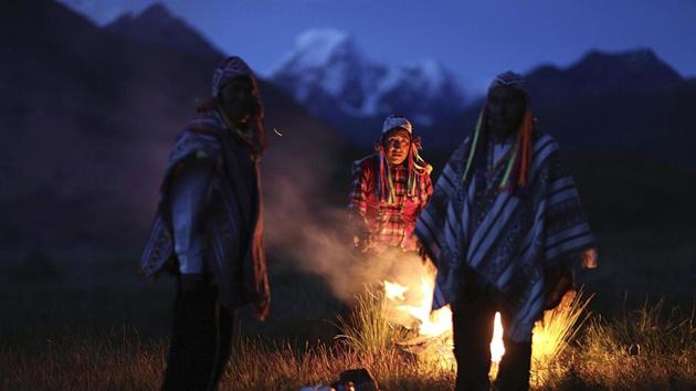 Andean farmers perform a ceremony honouring Mother Earth and Father Snowy Mountain. Dina Farfan, a Peruvian biologist who has studied threatened wildlife said a 4km dirt trail which is climbed by tourists to reach Rainbow Mountain has been badly eroded in the last 18 months, scarring the otherwise pristine landscape. Even a wetland once popular with migrating ducks has been turned into a parking lot. (Martin Mejia / AP) Andean farmers perform a ceremony honouring Mother Earth and Father Snowy Mountain. Dina Farfan, a Peruvian biologist who has studied threatened wildlife said a 4km dirt trail which is climbed by tourists to reach Rainbow Mountain has been badly eroded in the last 18 months, scarring the otherwise pristine landscape. Even a wetland once popular with migrating ducks has been turned into a parking lot. (Martin Mejia / AP)
