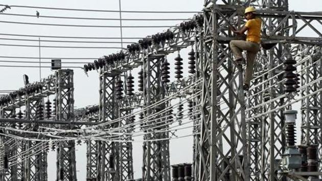 An employee works on electric pylons at a power station in Greater Noida on the outskirts of New Delhi June 8, 2012. (Reuters File Photo) An employee works on electric pylons at a power station in Greater Noida on the outskirts of New Delhi June 8, 2012. (Reuters File Photo)