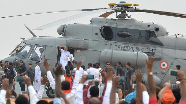 Prime Minister Narendra Modi greets BJP supporters after landing in an Indian Air Force helicopter at an election campaign rally in Bangalore, Karnataka on May 3, 2018. (Manjunath Kiran / AFP) Prime Minister Narendra Modi greets BJP supporters after landing in an Indian Air Force helicopter at an election campaign rally in Bangalore, Karnataka on May 3, 2018. (Manjunath Kiran / AFP)
