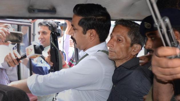 Vijay Singh (C), the man accused of killing Shail Bala Sharma the officer leading a demolition drive against illegal constructions in Himachal Pradesh’s Kasauli town has said he shot her “out of anger” after she refused to accept a bribe. (PTI) Vijay Singh (C), the man accused of killing Shail Bala Sharma the officer leading a demolition drive against illegal constructions in Himachal Pradesh’s Kasauli town has said he shot her “out of anger” after she refused to accept a bribe. (PTI)