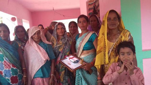Sunita with villagers in Bahraich. (HT) Sunita with villagers in Bahraich. (HT)