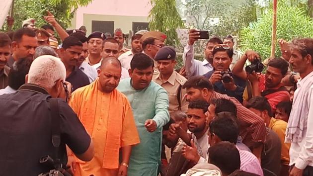 Chief minister Yogi Adityanath meets storm-affected villagers in Agra district on Saturday. (HT Photo) Chief minister Yogi Adityanath meets storm-affected villagers in Agra district on Saturday. (HT Photo)