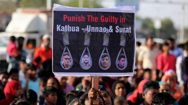 File photo of people holding placards at a protest against the rape of an eight-year-old girl, in Kathua, near Jammu, a teenager in Unnao, Uttar Pradesh state, and an eleven-year-old girl in Surat on April 22. (REUTERS) File photo of people holding placards at a protest against the rape of an eight-year-old girl, in Kathua, near Jammu, a teenager in Unnao, Uttar Pradesh state, and an eleven-year-old girl in Surat on April 22. (REUTERS)