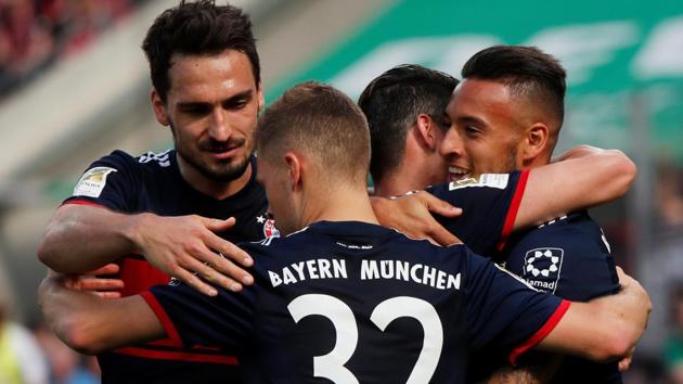 Bayern Munich's Corentin Tolisso celebrates with team mates after scoring their third goal against FC Cologne.(REUTERS)