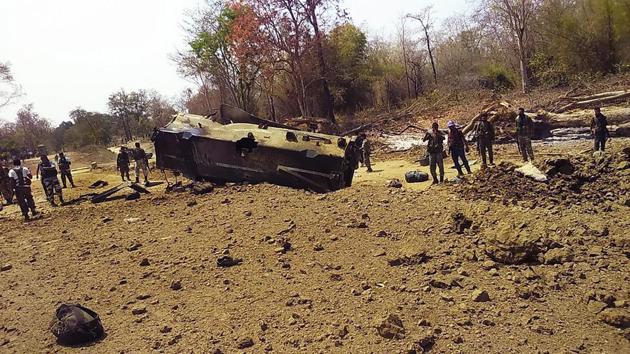 Security personnel inspect the site of an IED blast where nine CRPF personnel were killed and two more were injured after Maoists ambushed them in Kistaram area of Chhattisgarh’s Sukma district.(PTI File Photo)