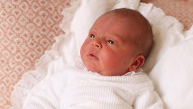 A handout picture released by Kensington Palace on May 5, 2018 shows Britain's Prince Louis of Cambridge posing for a photograph, taken by his mother, Britain's Catherine, Duchess of Cambridge, at Kensington Palace in central London on April 26, 2018.(AFP)