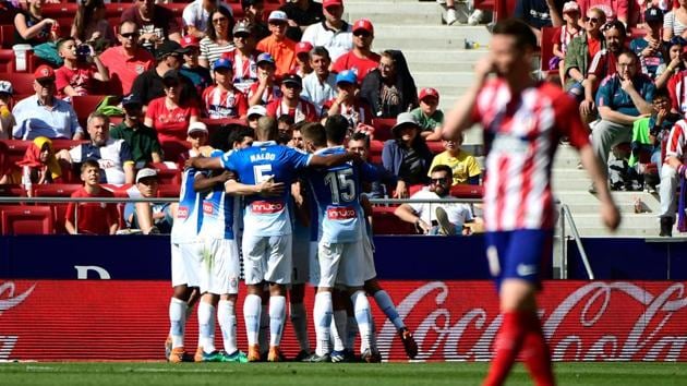 Espanyol's players celebrate after scoring a goal during the La Liga match against Atletico Madrid at the Wanda Metropolitano stadium in Madrid on May 6.(AFP)