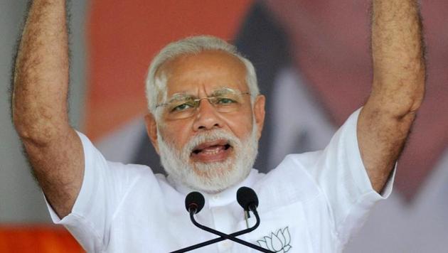 Prime Minister Narendra Modi gestures as he speaks during a public rally ahead of the Karnataka assembly election 2018 in Tumakuru on Saturday.(PTI)