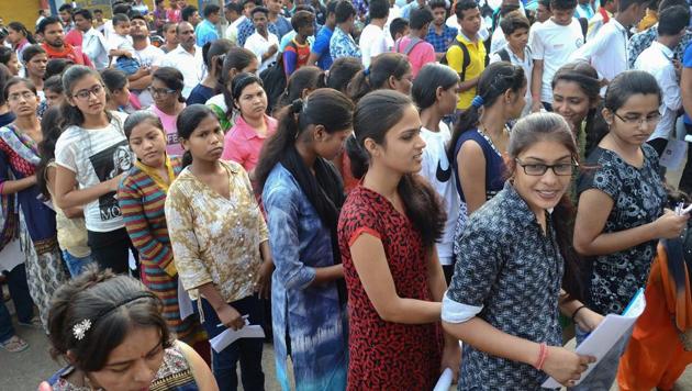 Applicants wait outside an examination centre to appear in the National Eligibility-Cum-Entrance Test 2018, in Jabalpur on Sunday.(PTI) Applicants wait outside an examination centre to appear in the National Eligibility-Cum-Entrance Test 2018, in Jabalpur on Sunday.(PTI)