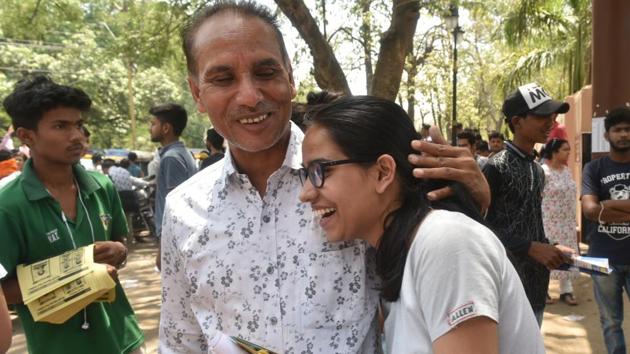 A student celebrates with her father after taking the entrance test on Sunday. (Mujeeb Faruqui/HT Photo) A student celebrates with her father after taking the entrance test on Sunday. (Mujeeb Faruqui/HT Photo)