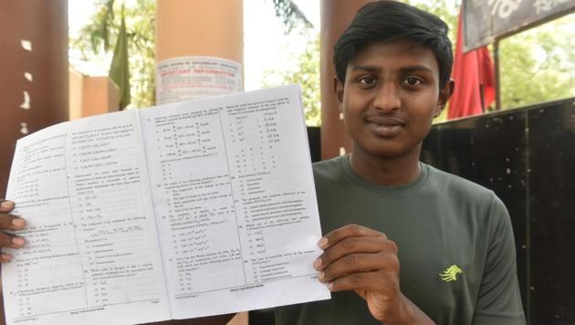 A student displays the NEET question paper at the Kendriya Vidyalaya exam centre in Bhopal, MP, on Sunday, May 6, 2018. (Mujeeb Faruqui/HT Photo) A student displays the NEET question paper at the Kendriya Vidyalaya exam centre in Bhopal, MP, on Sunday, May 6, 2018. (Mujeeb Faruqui/HT Photo)