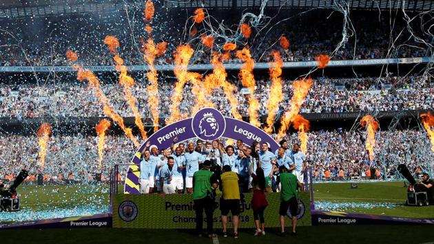 Manchester City celebrate with the trophy on Sunday. (REUTERS) Manchester City celebrate with the trophy on Sunday. (REUTERS)