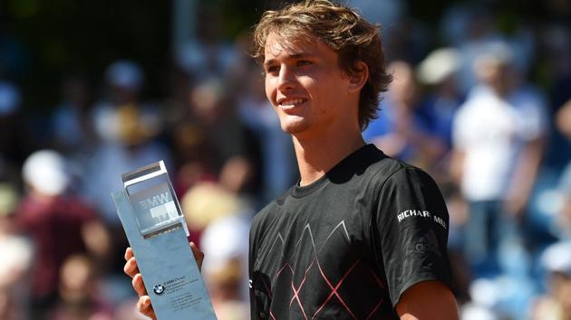 Alexander Zverev poses with the trophy after defeating his compatriot Philipp Kohlschreiber in the Munich Open final.(AFP)