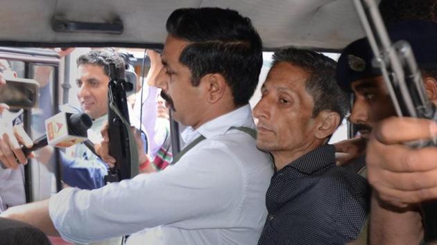 Police produce Vijay Singh, who allegedly shot dead Assistant Town and Country Planning officer Shail Bala Sharma during an anti-demolition drive on May 1, in a court in Kasauli.(PTI File Photo) Police produce Vijay Singh, who allegedly shot dead Assistant Town and Country Planning officer Shail Bala Sharma during an anti-demolition drive on May 1, in a court in Kasauli.(PTI File Photo)