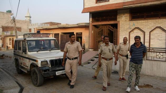 Police deployed outside house of Bhagwan brothers in Rohtak’s Karor village on Saturday.(Manoj Dhaka/HT)