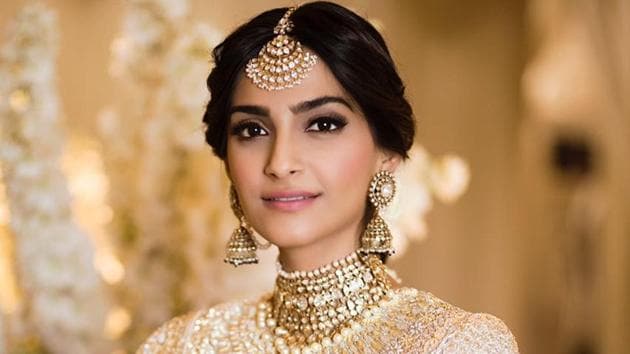 Sonam Kapoor wore a beautiful white-golden dress to her sangeet on Monday.(Viral Bhayani)