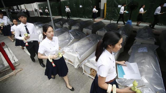 Medical students arrive for a ceremony to pay respects to cadavers used in their studies at Chulalongkorn Hospital in Bangkok, Thailand. The students said prayers over the coffins of some 300 cadavers in a solemn ceremony to bid farewell to the corpses who helped them sharpen their dissection and anatomy knowledge. (Sakchai Lalit / AP) Medical students arrive for a ceremony to pay respects to cadavers used in their studies at Chulalongkorn Hospital in Bangkok, Thailand. The students said prayers over the coffins of some 300 cadavers in a solemn ceremony to bid farewell to the corpses who helped them sharpen their dissection and anatomy knowledge. (Sakchai Lalit / AP)
