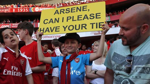 A young supporter, seven year old Luca Iacurti wears a tie which Arsenal's French manager Arsene Wenger was wearing after the English Premier League football match between Arsenal and Burnley. (AFP) A young supporter, seven year old Luca Iacurti wears a tie which Arsenal's French manager Arsene Wenger was wearing after the English Premier League football match between Arsenal and Burnley. (AFP)