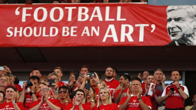 Arsenal supporters wait behind to honour Arsenal's French manager Arsene Wenger after the match against Burnley. (AFP) Arsenal supporters wait behind to honour Arsenal's French manager Arsene Wenger after the match against Burnley. (AFP)