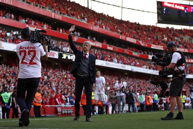 Arsenal manager Arsene Wenger gestures to supporters as he does a lap of honour on the pitch. (AFP) Arsenal manager Arsene Wenger gestures to supporters as he does a lap of honour on the pitch. (AFP)