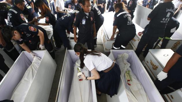 Medical students and volunteers lay down garlands, paying respects to the cadavers. “We don’t really know the people, but for me, we are close... we spend a lot of time together,” said 21-year-old Paspimol Kositchaiwat, who is in her second year of medical school at Bangkok’s Chulalongkorn University. (Sakchai Lalit / AP) Medical students and volunteers lay down garlands, paying respects to the cadavers. “We don’t really know the people, but for me, we are close... we spend a lot of time together,” said 21-year-old Paspimol Kositchaiwat, who is in her second year of medical school at Bangkok’s Chulalongkorn University. (Sakchai Lalit / AP)