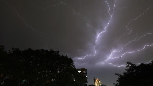 Lightning strikes over residential apartments during a thunderstorm on the outskirts of New Delhi on May 2, 2018. (AFP) Lightning strikes over residential apartments during a thunderstorm on the outskirts of New Delhi on May 2, 2018. (AFP)