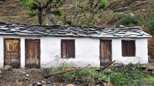 Locked doors of a house in Garhwal region. The report also warns that migration into urban areas is causing additional stress on the already over stressed towns and cities.(Vinay Santosh Kumar/HT Photo)