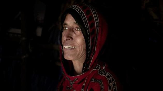 Hagar Yahia, a mother of eight, cries in her hut in Abyan. Displaced from their home and scrounging for work, she and her husband can barely afford to buy enough food for their family. “I go hungry for my children. I prefer that I don’t eat so they can,” she said. Nearly a third of Yemen’s population — 8.4 million of its 29 million people — rely completely on food aid or else they would starve. (Nariman El-Mofty / AP) Hagar Yahia, a mother of eight, cries in her hut in Abyan. Displaced from their home and scrounging for work, she and her husband can barely afford to buy enough food for their family. “I go hungry for my children. I prefer that I don’t eat so they can,” she said. Nearly a third of Yemen’s population — 8.4 million of its 29 million people — rely completely on food aid or else they would starve. (Nariman El-Mofty / AP)