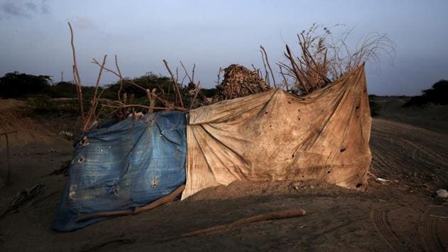 A hut made of tree limbs and rags tha Hagar Yahia and her family call home. Her family is among 18,000 people who escaped war zones further west and streamed into Abyan province. It isn’t just those driven from their homes who suffer. Isolated in a mountain valley, the 450 residents of the village of Qibli have been waiting for aid since 2016, according to a relief volunteer. (Nariman El-Mofty / AP) A hut made of tree limbs and rags tha Hagar Yahia and her family call home. Her family is among 18,000 people who escaped war zones further west and streamed into Abyan province. It isn’t just those driven from their homes who suffer. Isolated in a mountain valley, the 450 residents of the village of Qibli have been waiting for aid since 2016, according to a relief volunteer. (Nariman El-Mofty / AP)