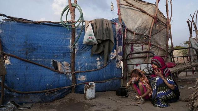 Awsaf, a 5-year-old Yemeni girl sits, next to her mother near her hut, drinking tea which on many days is the only food the family manages. Save the Children estimates that 50,000 children may have died in 2017 of extreme hunger or disease in Yemen. Deprived of food, the only defense against their hunger are mothers who skip meals and sleep to escape the gnawing in their stomachs at bay. (Nariman El-Mofty / AP) Awsaf, a 5-year-old Yemeni girl sits, next to her mother near her hut, drinking tea which on many days is the only food the family manages. Save the Children estimates that 50,000 children may have died in 2017 of extreme hunger or disease in Yemen. Deprived of food, the only defense against their hunger are mothers who skip meals and sleep to escape the gnawing in their stomachs at bay. (Nariman El-Mofty / AP)