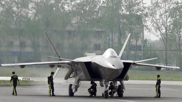 Chinese ground crew members inspect a J-20 stealth fighter in Chengdu, in southwest China's Sichuan province. (AP File Photo) Chinese ground crew members inspect a J-20 stealth fighter in Chengdu, in southwest China's Sichuan province. (AP File Photo)