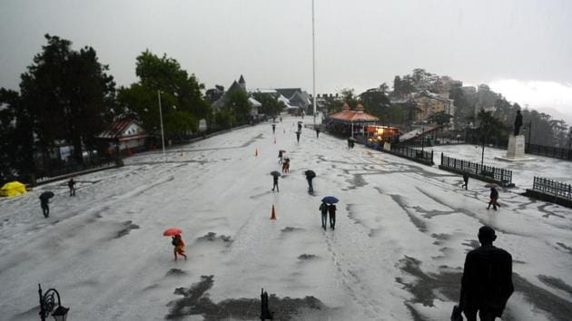 The roads were covered with a white carpet while gushing water flowed through narrow streets. (Deepak Sansta/HT)