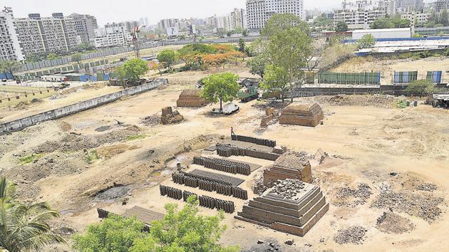 A brick kiln surrounded by various residential societies as seen from one of the apartments of Shonest Towers in Wakad.(HT Photo)