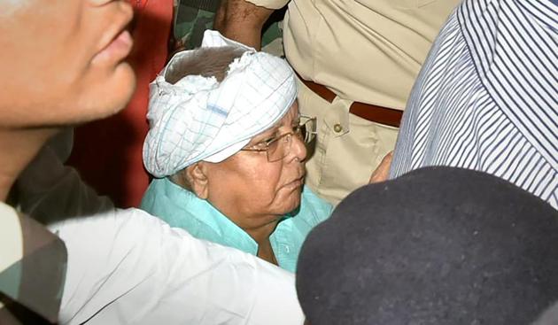 Rashtriya Janata Dal (RJD) chief Lalu Prasad Yadav arrives at Ranchi Railway Station amid heavy security. (PTI FILE) Rashtriya Janata Dal (RJD) chief Lalu Prasad Yadav arrives at Ranchi Railway Station amid heavy security. (PTI FILE)