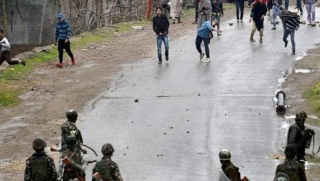 File photo of a group pelting stones at security forces in Budgam district in Kashmir.(PTI) File photo of a group pelting stones at security forces in Budgam district in Kashmir.(PTI)