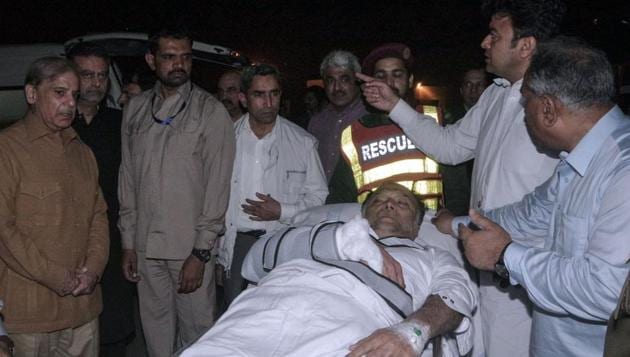 Injured Pakistan's interior minister Ahsan Iqbal is evacuated from a helicopter on their arrival in Lahore. (AFP via PID handout) Injured Pakistan's interior minister Ahsan Iqbal is evacuated from a helicopter on their arrival in Lahore. (AFP via PID handout)