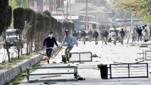 College students clash with security personnel in Srinagar recently.(Ajay Aggarwal/HT File)