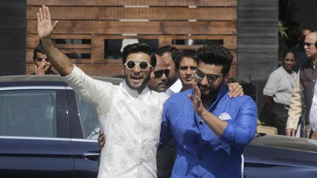 Bollywood actors Ranveer Singh, left, along with Arjun Kapoor leaves after attending the wedding ceremony of Sonam Kapoor in Mumbai.(AP)