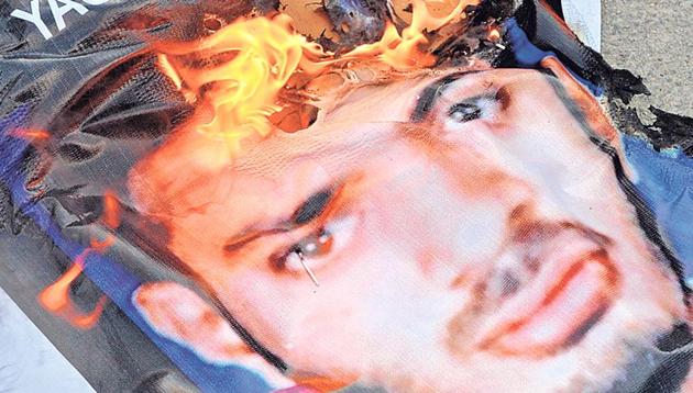 A poster of founding member of the banned terror group Indian Mujahideen Yasin Bhatkal being burnt during a protest. When Bhatkal was arrested in 2009 by the West Bengal Police for carrying fake currency, he found his way out by claiming to be Malda resident Shah Rukh.(AFP file photo)