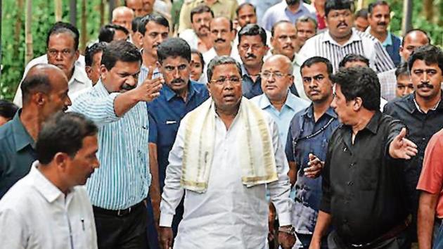 The ongoing campaign in the state is a contest between CM Siddaramaiah (centre) and PM Narendra Modi. (Arijit Sen/HT file) The ongoing campaign in the state is a contest between CM Siddaramaiah (centre) and PM Narendra Modi. (Arijit Sen/HT file)