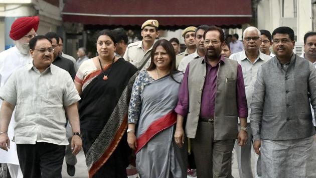 BJP delegation lead by Union Minister JP Nadda, Mukhtar Abbas Naqvi, Smriti Irani, Dharmendra Pradhan, SS Ahluwalia, Meenakashi Lekhi and others leave after meeting the Election Commission in New Delhi, on Wednesday, on the issue of fake voter IDs found in Bengaluru.(Sonu Mehta / Hindustan Times)