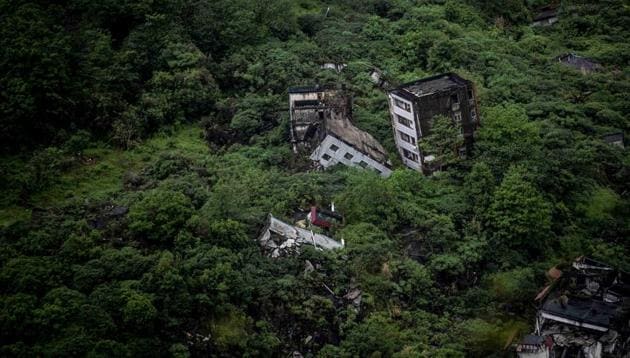 As China prepares for Saturday’s 10-year anniversary of the 2008 disaster when a 7.9-magnitude earthquake left 87,000 people dead or missing across Sichuan province, Chen Guoxing’s team of around 200 carry out the physically and emotionally draining work of preserving the wreckage in which an estimated 20,000 bodies may be entombed. (Johannes Eisele / AFP) As China prepares for Saturday’s 10-year anniversary of the 2008 disaster when a 7.9-magnitude earthquake left 87,000 people dead or missing across Sichuan province, Chen Guoxing’s team of around 200 carry out the physically and emotionally draining work of preserving the wreckage in which an estimated 20,000 bodies may be entombed. (Johannes Eisele / AFP)